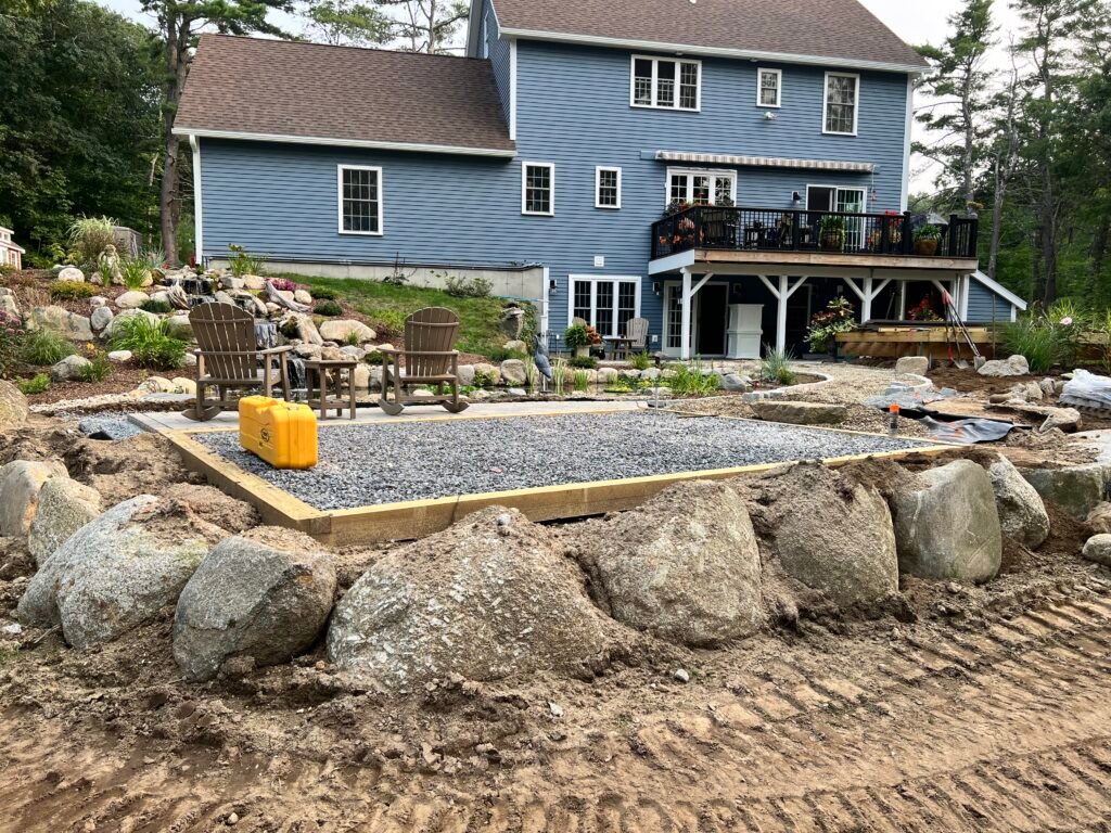 Boulder wall shed pad